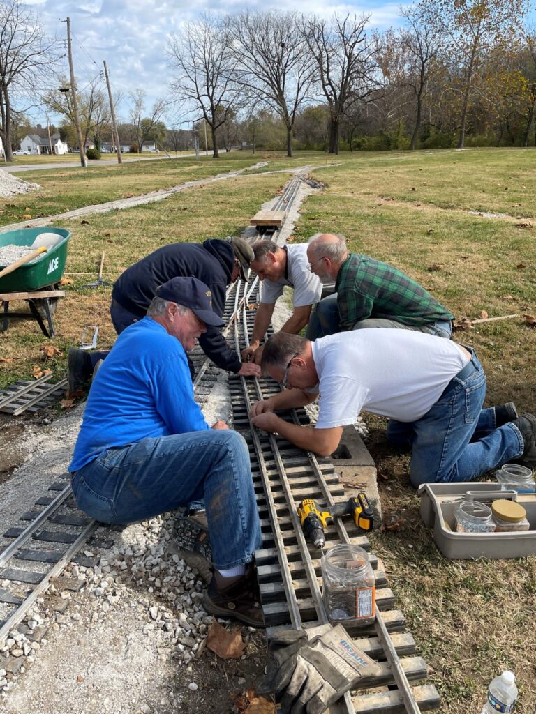 A MOLS volunteer connecting up a dual-gauge track switch